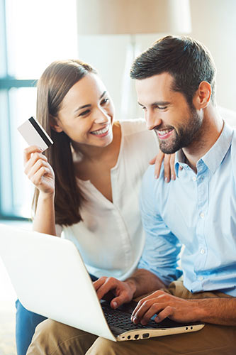 Young couple looking up how to buy life insurance online