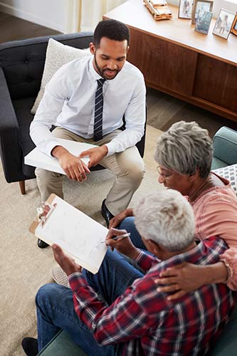Senior couple meeting with their financial advisor to purchase a MYGA