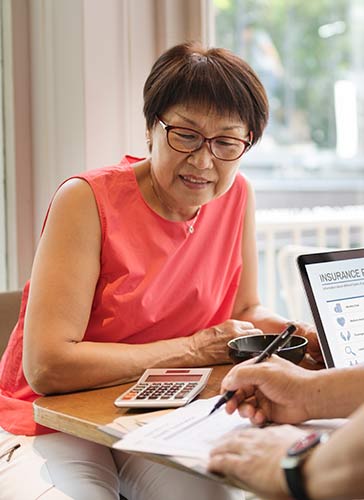 Senior woman working with her financial advisor to create a retirement plan with MYGAs