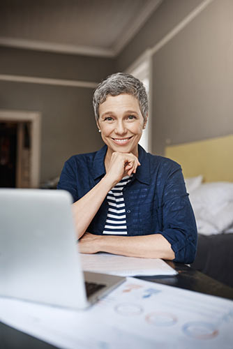 Senior woman making a retirement plan and budget at her laptop
